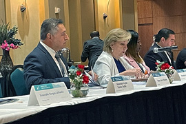 Secretary Nelson sitting at a table with leaders. 