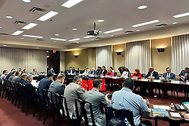 Secretary Nelson sitting at a table with other stakeholders.